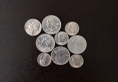 Figure 1: An example image containing touching objects. Our goal is to detect and extract each of these coins individually.