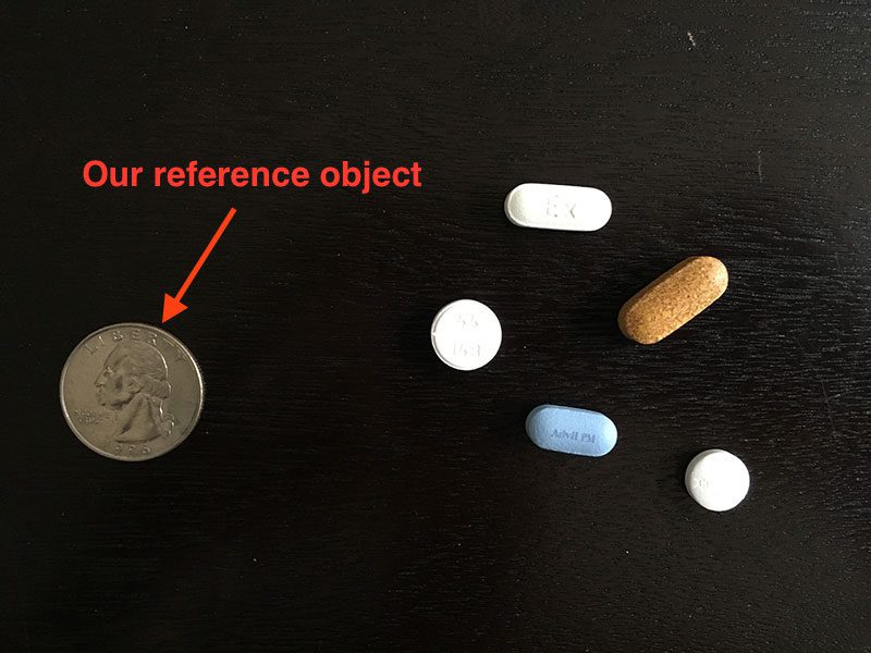 Figure 1: We'll use a United States quarter as our reference object and ensure it is always placed as the left-most object in the image, making it easy for us to extract it by sorting contours based on their location.